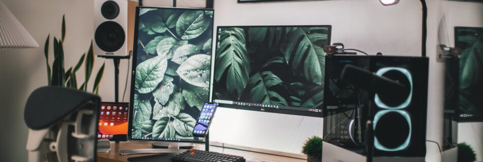 black flat screen computer monitor on white wooden desk